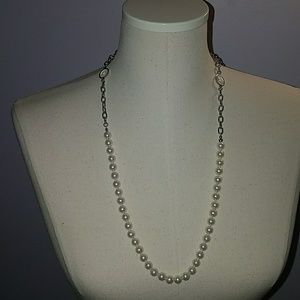 Pearl and silver chain necklace.